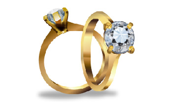 two golden engagement rings